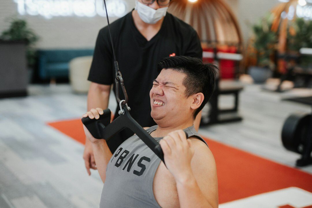 Studio portrait of a smiling Chinese Singaporean man instructor in business casual attire