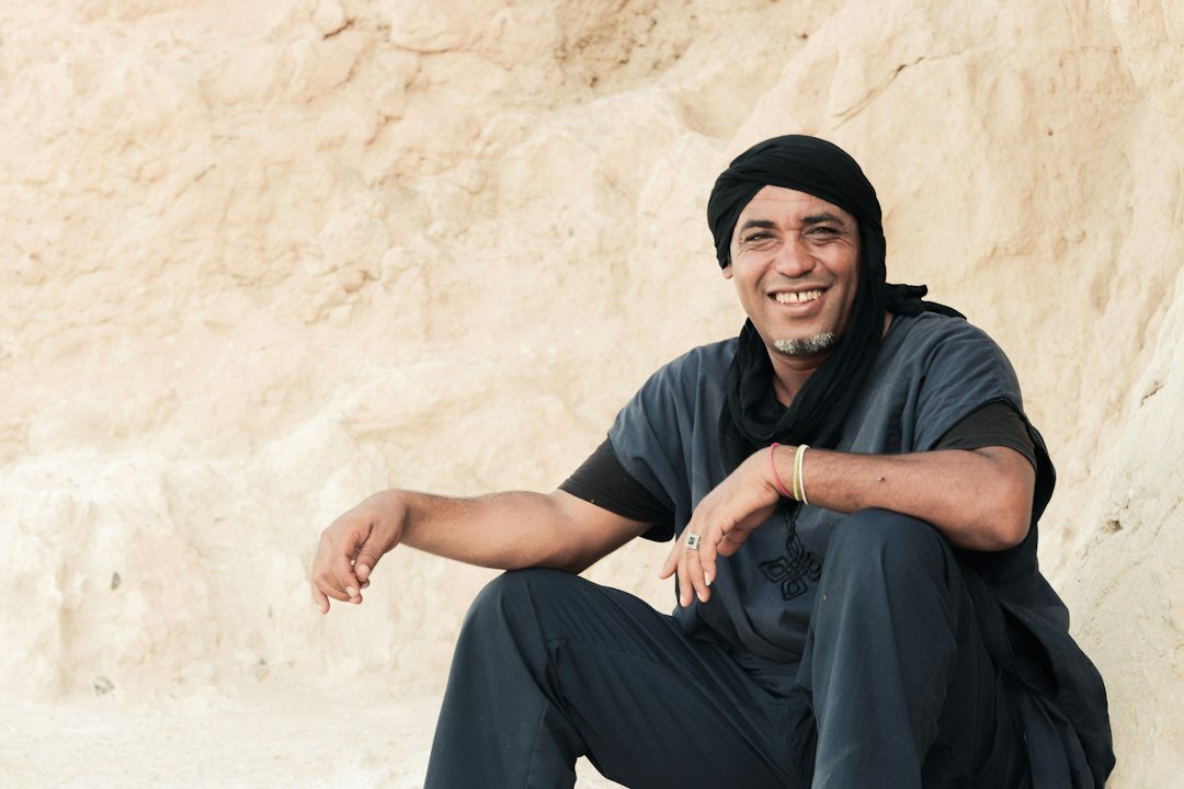 Studio portrait of a smiling Indian Singaporean man instructor in business casual attire