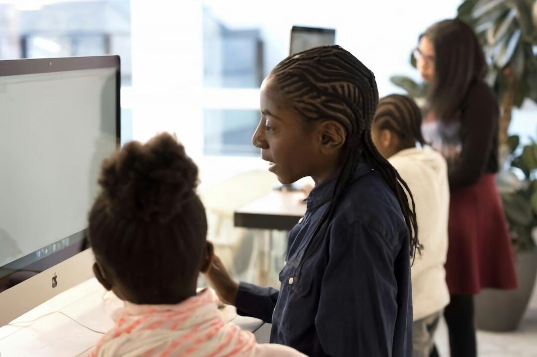 diverse students coding together